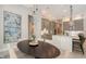 An open-concept dining room featuring modern lighting and neutral decor at 8348 Catamaran Cir, Lakewood Ranch, FL 34202
