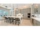 Modern kitchen with a large center island, stylish stools, and stainless steel appliances at 8348 Catamaran Cir, Lakewood Ranch, FL 34202