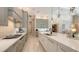 Bright, modern kitchen with stainless steel appliances, a large island, and custom cabinets at 8348 Catamaran Cir, Lakewood Ranch, FL 34202