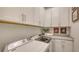 Convenient laundry room features modern appliances, ample storage, and stylish countertops at 8348 Catamaran Cir, Lakewood Ranch, FL 34202