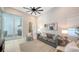 Inviting living room features neutral tones, comfortable seating, and seamless access to outdoor patio at 8348 Catamaran Cir, Lakewood Ranch, FL 34202