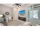 Spacious living room with TV and sliding glass doors to lanai at 8348 Catamaran Cir, Lakewood Ranch, FL 34202