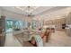 Spacious living room featuring stylish seating, a ceiling fan, and an open floor plan at 8348 Catamaran Cir, Lakewood Ranch, FL 34202