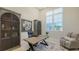 Well-lit home office featuring a vintage desk and rustic decor at 8348 Catamaran Cir, Lakewood Ranch, FL 34202