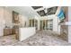 Well-appointed outdoor kitchen, complete with grill, bar seating, fireplace, and lounge area at 8348 Catamaran Cir, Lakewood Ranch, FL 34202