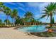 Resort-style pool area with lounge chairs and lush tropical landscaping, a perfect oasis for relaxation at 8348 Catamaran Cir, Lakewood Ranch, FL 34202