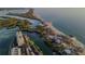 Aerial view of homes and condos near the beach and open ocean waters at 8767 Midnight Pass Rd # 403F, Sarasota, FL 34242