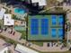Aerial shot of the tennis court and pool at 8767 Midnight Pass Rd # 403F, Sarasota, FL 34242