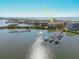 An aerial view showcasing a waterfront condo with docks, and nearby ocean access at 8767 Midnight Pass Rd # 403F, Sarasota, FL 34242