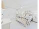 Bright, all-white bedroom with a coastal theme, a ceiling fan, and lots of natural light at 8767 Midnight Pass Rd # 403F, Sarasota, FL 34242