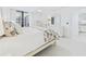 Bright bedroom with a king bed and sliding doors to a balcony at 8767 Midnight Pass Rd # 403F, Sarasota, FL 34242