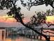 Scenic view of a boat dock at sunset at 8767 Midnight Pass Rd # 403F, Sarasota, FL 34242