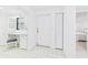 Bright hallway featuring a built-in desk and storage with easy access to the bedroom at 8767 Midnight Pass Rd # 403F, Sarasota, FL 34242