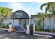 Charming restaurant entrance with Ophelia's sign, potted plants, and bench seating at 8767 Midnight Pass Rd # 403F, Sarasota, FL 34242