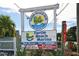 Turtle Beach Grill and Marina sign highlighting boat services, rentals, and dockside dining at 8767 Midnight Pass Rd # 403F, Sarasota, FL 34242