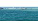 Beautiful clear waters with boats and people enjoying the shallow sandbar at 8767 Midnight Pass Rd # 403F, Sarasota, FL 34242