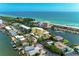 Stunning aerial view of the condo building nestled along the waterfront, offering serene coastal living at 9122 Midnight Pass Rd # 24, Sarasota, FL 34242