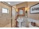 Bathroom featuring a glass shower, stylish vanity, and a decorative mirror and lighting at 9122 Midnight Pass Rd # 24, Sarasota, FL 34242