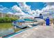 A collection of docked boats and a marina with a sign that says Siesta Key Marina, Rental, Sales, and Service at 9122 Midnight Pass Rd # 24, Sarasota, FL 34242