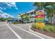 Commercial building with parking, signage, and palm trees; offering jet ski and parasailing services at 9122 Midnight Pass Rd # 24, Sarasota, FL 34242