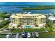 Beautiful waterfront condo building with boat docks and a refreshing pool overlooking scenic bay views at 9122 Midnight Pass Rd # 24, Sarasota, FL 34242