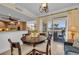 Bright dining area with sliding doors to the patio, offering natural light and a seamless indoor/outdoor living experience at 9122 Midnight Pass Rd # 24, Sarasota, FL 34242