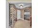 Elegant elevator lobby with a decorative display case and stainless steel elevator doors at 9122 Midnight Pass Rd # 24, Sarasota, FL 34242
