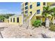 Elegant multi-story building with a well-maintained entrance, complete with stylish landscaping and an inviting staircase at 9122 Midnight Pass Rd # 24, Sarasota, FL 34242