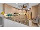 Modern kitchen features granite countertops, stainless steel appliances, and ample cabinet space for storage at 9122 Midnight Pass Rd # 24, Sarasota, FL 34242