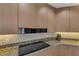 Close-up of modern kitchen with granite counters, offering sleek and efficient cooking space at 9122 Midnight Pass Rd # 24, Sarasota, FL 34242