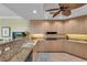 Spacious kitchen with granite countertops, stainless steel appliances, and a functional layout at 9122 Midnight Pass Rd # 24, Sarasota, FL 34242