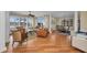 Open-concept living area boasts hardwood floors, plantation shutters, and elegant furnishings at 9122 Midnight Pass Rd # 24, Sarasota, FL 34242