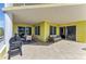 Expansive outdoor patio features lounge seating, dining area, and grill, perfect for entertaining and enjoying the fresh air at 9122 Midnight Pass Rd # 24, Sarasota, FL 34242