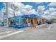 Exterior of a charming restaurant with outdoor seating, featuring curbside pick-up, fresh cooking, and a tiki bar at 9122 Midnight Pass Rd # 24, Sarasota, FL 34242