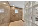 Shower with unique tile design, rain shower head, and a built-in niche for toiletries at 9122 Midnight Pass Rd # 24, Sarasota, FL 34242