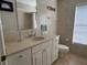 Bright bathroom featuring a vanity with sink and a toilet with tile flooring and walls at 4906 Peridia E Blvd, Bradenton, FL 34203