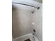 Bathroom showcasing a tub and shower combination surrounded by tiled walls at 4906 Peridia E Blvd, Bradenton, FL 34203