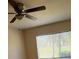Bedroom ceiling fan and bright natural light from the window at 4906 Peridia E Blvd, Bradenton, FL 34203