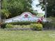 Peridia Golf & Country Club sign surrounded by lush landscaping for a welcoming entrance at 4906 Peridia E Blvd, Bradenton, FL 34203