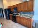 Well-equipped kitchen featuring custom cabinets, granite countertops, and modern appliances at 4906 Peridia E Blvd, Bradenton, FL 34203