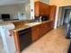 Spacious kitchen featuring stone countertops and eat in breakfast bar at 4906 Peridia E Blvd, Bradenton, FL 34203