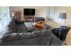 Comfortable living room with a large sectional sofa and contemporary decor at 4906 Peridia E Blvd, Bradenton, FL 34203