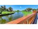 Scenic view of a tranquil pond surrounded by lush greenery, creating a peaceful outdoor ambiance at 4906 Peridia E Blvd, Bradenton, FL 34203