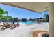 Relaxing pool area with ample seating and shade, perfect for enjoying sunny days at 4906 Peridia E Blvd, Bradenton, FL 34203