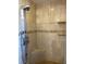 Modern shower with multiple shower heads and tiled walls for a luxurious experience at 4906 Peridia E Blvd, Bradenton, FL 34203