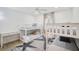 bedroom with white bunk beds, a desk, and a fun, star-themed rug at 7251 Sunnybrook Blvd, Englewood, FL 34224