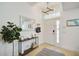 Bright entryway showcasing a modern light fixture and a decorative mirror at 7251 Sunnybrook Blvd, Englewood, FL 34224