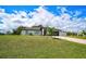 Beautiful home exterior with a manicured lawn and a long driveway at 7251 Sunnybrook Blvd, Englewood, FL 34224