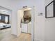 Bright laundry room with washer, dryer, shelving and storage space for organization at 7251 Sunnybrook Blvd, Englewood, FL 34224
