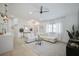 Bright living room featuring a white sectional sofa and neutral décor with lots of natural light at 7251 Sunnybrook Blvd, Englewood, FL 34224